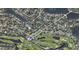 Aerial view of property in a neighborhood near a golf course and a lake at 515 Snell Isle Ne Blvd, St Petersburg, FL 33704