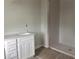 New bathroom vanity with quartz countertop, and tiled shower with a glass door, ready for finishing at 7268 Deer Valley Circle, Tampa, FL 33635