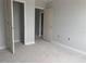 Spacious bedroom showing freshly painted walls, white trim, and paneled doors, ready for customization at 7268 Deer Valley Circle, Tampa, FL 33635