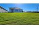 Spacious backyard with a lush green lawn, perfect for outdoor activities and relaxation at 1067 Signet, Apollo Beach, FL 33572