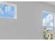 Bright bedroom featuring two windows, neutral paint, and ample natural light at 1067 Signet, Apollo Beach, FL 33572