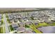 An aerial view of a sprawling residential community, showcasing various home styles and community layout with pond at 5516 Madrigal Way, Apollo Beach, FL 33572