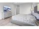 Modern bedroom boasts a silver dresser, TV, and a comfortable bed at 5516 Madrigal Way, Apollo Beach, FL 33572
