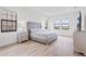 Modern bedroom offers ample natural light and neutral decor at 5516 Madrigal Way, Apollo Beach, FL 33572