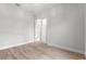 Cozy bedroom with wood floors and a doorway leading to another room at 5516 Madrigal Way, Apollo Beach, FL 33572