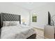 Cozy bedroom with stylish decor, comfortable bed, and ample natural light at 5516 Madrigal Way, Apollo Beach, FL 33572