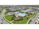 A beautiful view of a community pool, amenity center, and playground for residents at 5516 Madrigal Way, Apollo Beach, FL 33572