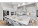 Bright kitchen with a large island, stainless steel appliances, and white cabinetry at 5516 Madrigal Way, Apollo Beach, FL 33572