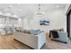 Open concept living room and kitchen area with modern furnishings and decor at 5516 Madrigal Way, Apollo Beach, FL 33572