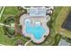An overhead view showcasing a community pool, playground, landscaped areas, and surrounding amenities at 5516 Madrigal Way, Apollo Beach, FL 33572