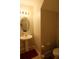 Simple bathroom with a pedestal sink, neutral paint, and essential fixtures at 14825 Crescent Rock Dr, Wimauma, FL 33598