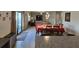 Bright dining area with a red tablecloth setting a warm and inviting mood, perfect for Gathering dinners at 14825 Crescent Rock Dr, Wimauma, FL 33598