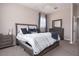Cozy bedroom boasts natural light, stylish furnishings, and neutral color palette at 2353 Max Ct, New Port Richey, FL 34655