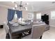 Open dining area features hardwood floors and a modern light fixture with a view to the living room at 2353 Max Ct, New Port Richey, FL 34655