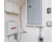 A view of two interior wall-mounted electrical panels, wiring, and an outlet at 2353 Max Ct, New Port Richey, FL 34655