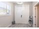 Bright entryway featuring double front doors, chandelier, and neutral decor at 2353 Max Ct, New Port Richey, FL 34655