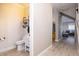 Contemporary half bathroom and staircase in home's entry with modern flooring at 2353 Max Ct, New Port Richey, FL 34655