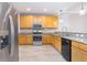 Modern kitchen featuring stainless steel appliances, granite countertops, and sleek cabinetry at 2353 Max Ct, New Port Richey, FL 34655