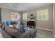 Comfortable living room featuring stylish furniture, ceiling fan and modern wood floors at 2353 Max Ct, New Port Richey, FL 34655