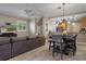 Stylish living room with modern wood floors, ceiling fan and open layout to kitchen at 2353 Max Ct, New Port Richey, FL 34655