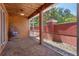 Relaxing screened-in patio with brick floors, wood ceiling, and decorative hanging swing at 2353 Max Ct, New Port Richey, FL 34655