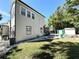 This home offers a spacious yard, storage shed, and lush green lawn at 3025 W North A St, Tampa, FL 33609