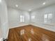 Light-filled bedroom with hardwood floors, fresh paint, and classic white trim at 3025 W North A St, Tampa, FL 33609