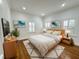 Warm bedroom with hardwood floors, neutral decor and natural light at 3025 W North A St, Tampa, FL 33609