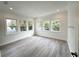 Bright bedroom featuring large windows and wood-look flooring, creating a modern and airy atmosphere at 3025 W North A St, Tampa, FL 33609