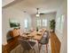 Dining area with hardwood floors, complemented by large windows and a ceiling fan at 3025 W North A St, Tampa, FL 33609