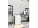 Exterior view featuring a home Tesla energy system and black framed windows at 3025 W North A St, Tampa, FL 33609