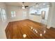 Bright and airy living room showcasing gleaming hardwood floors and natural light at 3025 W North A St, Tampa, FL 33609