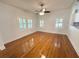 Spacious living room with hardwood floors and plantation shutters at 3025 W North A St, Tampa, FL 33609