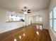 Open-concept living room with hardwood floors, seamlessly connected to the kitchen at 3025 W North A St, Tampa, FL 33609