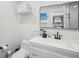 Bathroom featuring a modern vanity, an elegant mirror and ample storage for toiletries at 4335 S Coolidge Ave, Tampa, FL 33611