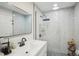 Elegant bathroom featuring a white vanity and a glass-enclosed walk-in shower at 4335 S Coolidge Ave, Tampa, FL 33611