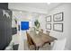 Stylish dining room showcasing an eye-catching blue front door and modern decor at 4335 S Coolidge Ave, Tampa, FL 33611