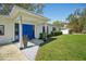 Inviting front entrance showcasing patterned tiles and a vibrant blue double door at 4335 S Coolidge Ave, Tampa, FL 33611