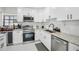 Contemporary kitchen equipped with stainless steel appliances and granite countertops at 4335 S Coolidge Ave, Tampa, FL 33611