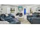 Bright and airy living room with an open view of the front entrance and kitchen at 4335 S Coolidge Ave, Tampa, FL 33611