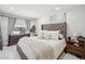 Cozy main bedroom features a large bed, neutral tones, and ample natural light at 4335 S Coolidge Ave, Tampa, FL 33611