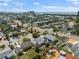 Expansive aerial view of a coastal neighborhood with charming homes and scenic ocean views in the background at 437 79Th Ave, St Pete Beach, FL 33706