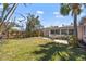 Spacious fenced backyard with a patio perfect for outdoor entertaining and relaxation at 437 79Th Ave, St Pete Beach, FL 33706