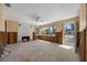 Bright living room with tile flooring, a fireplace, and exposed framing, presenting an opportunity for a personalized design at 437 79Th Ave, St Pete Beach, FL 33706