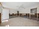Open-concept living space featuring tile flooring, a ceiling fan, and exposed wall framing, awaiting updates at 437 79Th Ave, St Pete Beach, FL 33706