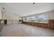 Bright living room with tile floors and large windows, showing exposed wall studs and potential for renovation at 437 79Th Ave, St Pete Beach, FL 33706