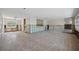 Spacious living room featuring tile flooring, large windows, and partial wall framing, ready for customization at 437 79Th Ave, St Pete Beach, FL 33706