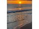 Beautiful ocean sunset with golden light reflecting on the gentle waves, creating a peaceful and scenic vista at 437 79Th Ave, St Pete Beach, FL 33706