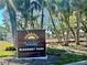 McKenney Park sign among palm trees, marking a beautiful spot known as the Sunset Capital of Florida at 437 79Th Ave, St Pete Beach, FL 33706