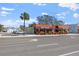 Tuttorosso Italian restaurant with outdoor seating and lush plants, offering a delightful and inviting ambiance for diners at 437 79Th Ave, St Pete Beach, FL 33706